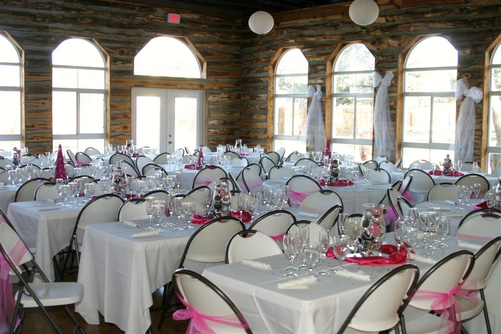 Wedding decorations adorn tables in the lodge.